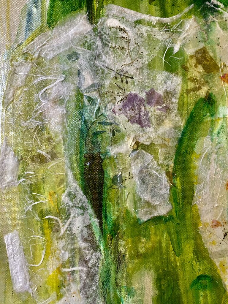 [Two gentle donkey ears emerging from textured green layers.]